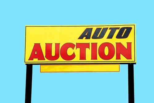 An 'Auto Auction' sign.